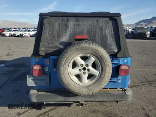 2003 Jeep Wrangler X z VIN 1J4FA39S33P320254, wystawiony jako Copart lot #52392525 z przebiegiem 206 325 mil mil oraz Szkoda całkowita • Salvage title. Historia ofert i sprzedaży dostępna na DreamBid. Obrazek 6.