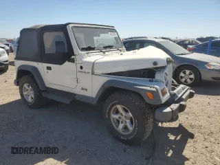 1997 Jeep Wrangler SE with VIN 1J4FY29PXVP411817, listed as a Copart auction lot 48755615 with 125,284 mi miles and Salvage Title. Bid and sale history available at DreamBid. Image 4.
