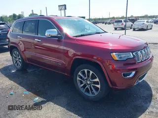 2017 Jeep Grand Cherokee Overland with VIN 1C4RJFCG7HC658943, listed as a IAAI auction lot 42282213 with 103,291 mi miles and . Bid and sale history available at DreamBid. Image 1.