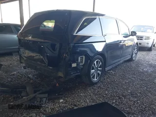 2014 Honda Odyssey Touring with VIN 5FNRL5H94EB110590, listed as a IAAI auction lot 42092929 with 242,338 mi miles and . Bid and sale history available at DreamBid. Image 4.