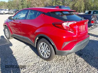 2020 Toyota C-HR LE with VIN JTNKHMBXXL1090061, listed as a IAAI auction lot 41124269 with 99,034 mi miles. Bid and sale history available at carsss.com. Image 3.