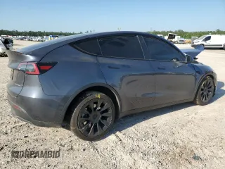 2023 Tesla Model Y Long Range z VIN 7SAYGDEE7PA199067, wystawiony jako Copart lot #52463215 z przebiegiem 30 978 mil mil oraz Szkoda całkowita • Salvage title. Historia ofert i sprzedaży dostępna na DreamBid. Obrazek 3.