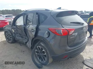 2016 Mazda CX-5 Grand Touring with VIN JM3KE4DY9G0845707, listed as a IAAI auction lot 41709685 with 96,351 mi miles. Bid and sale history available at carsss.com. Image 3.