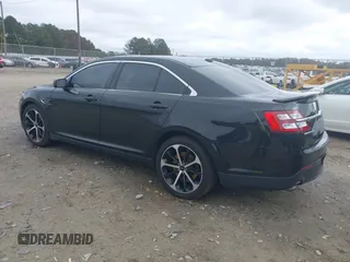 2015 Ford Taurus SHO with VIN 1FAHP2KT7FG148444, listed as a IAAI auction lot 40788614 with 121,533 mi miles and . Bid and sale history available at DreamBid. Image 3.