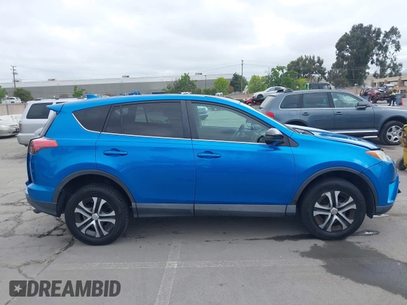 2018 Toyota RAV4 LE with VIN 2T3BFREV6JW740214, listed as a IAAI auction lot 42106349 with 105,831 mi miles and . Bid and sale history available at carsss.com. Image 14.