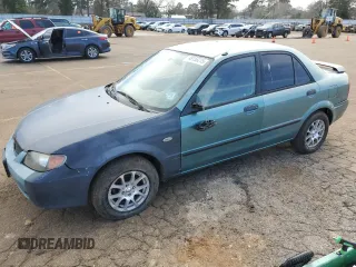 2001 Mazda Protege DX with VIN JM1BJ222310433605, listed as a Copart auction lot 49156215 with 205,146 mi miles and Salvage Title. Bid and sale history available at DreamBid. Image 1.