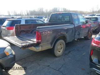 2000 Ford F-150 XL with VIN 1FTRX18W7YNA15739, listed as a IAAI auction lot 40954299 with 218,018 mi miles and . Bid and sale history available at DreamBid. Image 4.