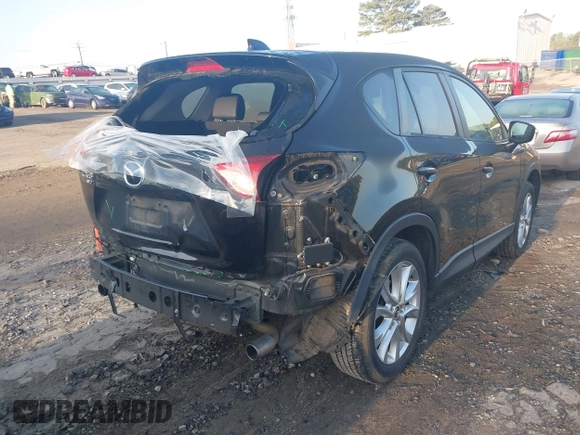 2015 Mazda CX-5 Grand Touring with VIN JM3KE4DY6F0513173, listed as a IAAI auction lot 41867030 with 93,770 mi miles. Bid and sale history available at carsss.com. Image 4.
