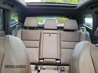 2023 BMW X1 xDrive28i with VIN WBX73EF08P5W51452, listed as a Copart auction lot 58420175 with 30,404 mi miles and Salvage title. Bid and sale history available at DreamBid. Image 10.