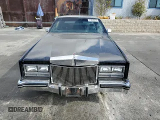 1985 Cadillac Eldorado z VIN 1G6EL578XFE640091, wystawiony jako Copart lot #71849374 z przebiegiem 30 631 mil mil oraz Szkody całkowita. Historia ofert i sprzedaży dostępna na DreamBid. Obrazek 5.