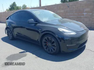 2021 Tesla Model Y Performance with VIN 5YJYGDEFXMF215895, listed as a IAAI auction lot 41622716 with 72,596 mi miles. Bid and sale history available at carsss.com. Image 1.