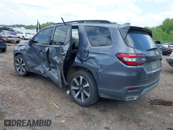 2024 Honda Pilot Touring with VIN 5FNYG2H7XRB014420, listed as a IAAI auction lot 41919635 with Not provided miles and . Bid and sale history available at DreamBid. Image 3.