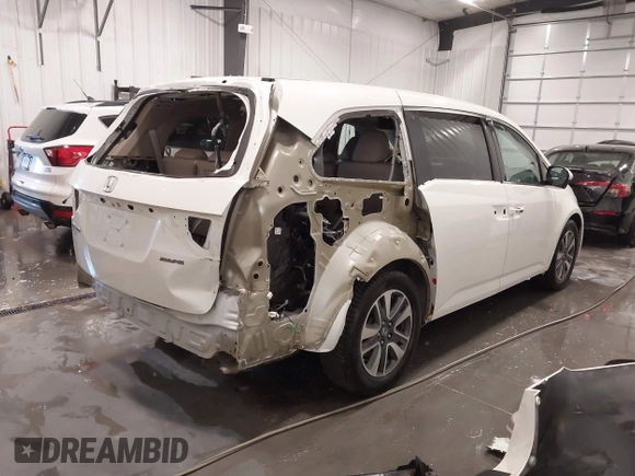 2015 Honda Odyssey Touring Elite with VIN 5FNRL5H92FB020159, listed as a IAAI auction lot 42103240 with 79,322 mi miles and . Bid and sale history available at DreamBid. Image 4.