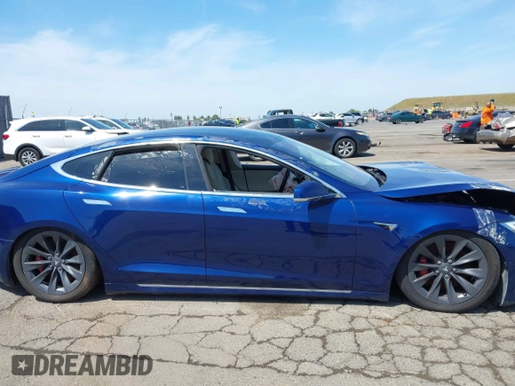 2017 Tesla Model S 100D with VIN 5YJSA1E44HF220391, listed as a IAAI auction lot 37381201 with Not Provided miles and . Bid and sale history available at DreamBid. Image 13.