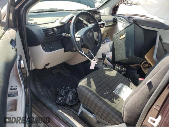 2013 Scion iQ with VIN JTNJJXB05DJ022305, listed as a Copart auction lot 58787155 with 136,046 mi miles and Salvage title. Bid and sale history available at DreamBid. Image 8.
