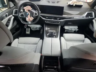 2024 BMW X5 M60i with VIN 5UX33EU08R9V21258, listed as a Copart auction lot 43411295 with 8,755 mi miles and Salvage Title. Bid and sale history available at carsss.com. Image 8.