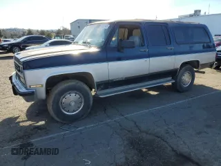 1991 Chevrolet Suburban z VIN 1GNGV26K1MF104219, wystawiony jako Copart lot #87527045 z przebiegiem 189 345 mil mil oraz Czysty tytuł • Clean title. Historia ofert i sprzedaży dostępna na DreamBid. Obrazek 1.