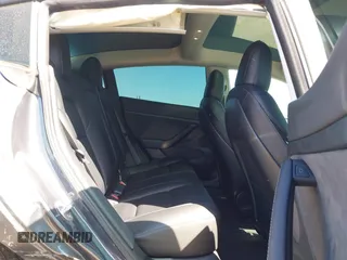 2023 Tesla Model 3 z VIN 5YJ3E1EA2PF404614, wystawiony jako IAAI lot #42009539 z przebiegiem 22 105 mil mil oraz . Historia ofert i sprzedaży dostępna na DreamBid. Obrazek 8.