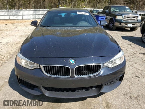 2015 BMW 4 Series 428i xDrive with VIN WBA4A7C58FD413734, listed as a Copart auction lot 50252325 with 74,629 mi miles and Salvage title. Bid and sale history available at DreamBid. Image 5.
