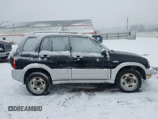2000 Suzuki Grand Vitara JLX z VIN JS3TD62V9Y4125906, wystawiony jako IAAI lot #41202351 z przebiegiem 146 300 mil mil oraz . Historia ofert i sprzedaży dostępna na DreamBid. Obrazek 13.