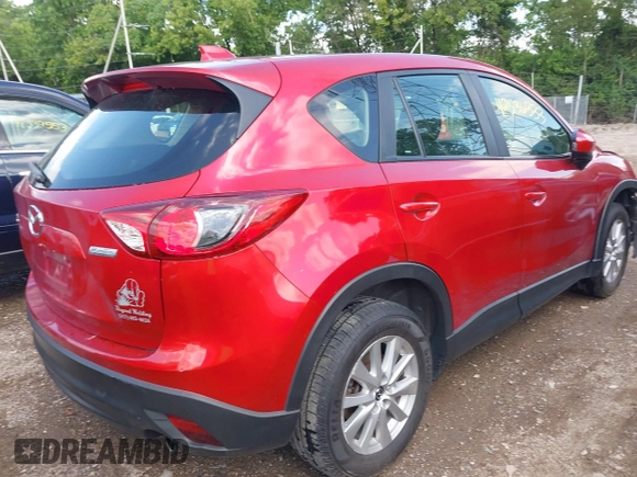 2015 Mazda CX-5 Sport with VIN JM3KE2BE8F0451014, listed as a IAAI auction lot 42536333 with 131,059 mi miles and . Bid and sale history available at DreamBid. Image 4.