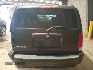 2008 Dodge Nitro SXT z VIN 1D8GT28K28W246131, wystawiony jako Copart lot #60037665 z przebiegiem 119 831 mil mil oraz Szkoda całkowita • Salvage title. Historia ofert i sprzedaży dostępna na DreamBid. Obrazek 6.