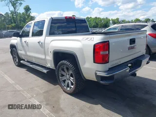 2014 GMC Sierra 1500 SLT with VIN 3GTU2VEC5EG548784, listed as a IAAI auction lot 42156738 with 118,809 mi miles and . Bid and sale history available at DreamBid. Image 3.