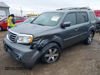 2012 Honda Pilot Touring with VIN 5FNYF4H98CB065003, listed as a IAAI auction lot 41989829 with 91,607 mi miles and . Bid and sale history available at DreamBid. Image 2.