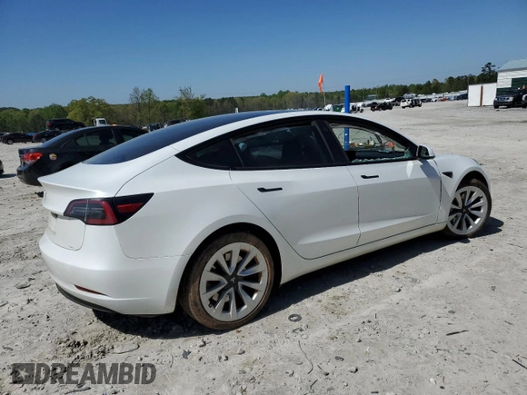 2023 Tesla Model 3 with VIN 5YJ3E1EA9PF558088, listed as a Copart auction lot 52228465 with 63,204 mi miles and Salvage title. Bid and sale history available at DreamBid. Image 3.