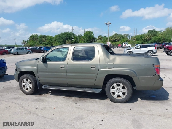 2007 Honda Ridgeline RTL w/Leather with VIN 2HJYK16527H547522, listed as a IAAI auction lot 41939603 with 127,899 mi miles. Bid and sale history available at carsss.com. Image 14.
