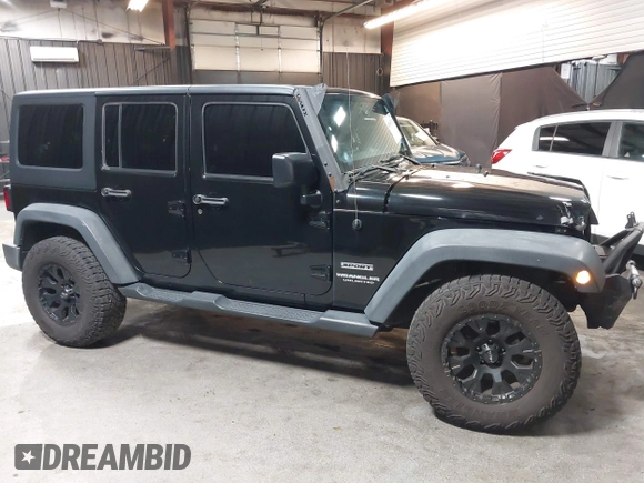 2015 Jeep Wrangler Unlimited Willys Wheeler with VIN 1C4BJWDG1FL749803, listed as a IAAI auction lot 41995132 with 156,595 mi miles and . Bid and sale history available at DreamBid. Image 14.