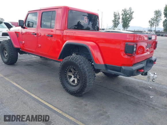 2021 Jeep Gladiator Rubicon with VIN 1C6JJTBGXML572976, listed as a IAAI auction lot 42134909 with 35,612 mi miles and . Bid and sale history available at DreamBid. Image 3.