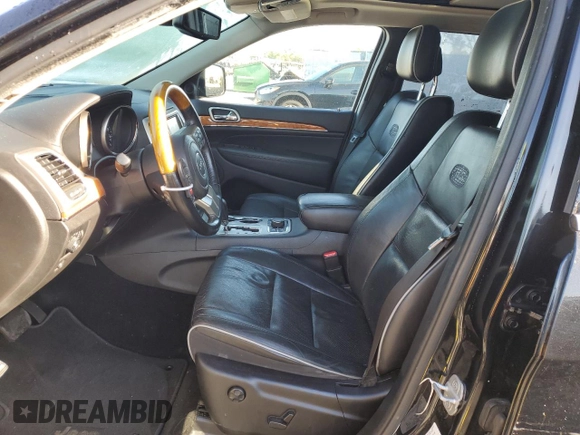 2013 Jeep Grand Cherokee Overland with VIN 1C4RJFCG2DC653207, listed as a Copart auction lot 48680885 with 276,020 mi miles and Salvage Title. Bid and sale history available at carsss.com. Image 7.