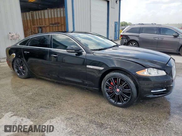 2014 Jaguar XJ Portfolio with VIN SAJWA2GZ2E8V64993, listed as a Copart auction lot 88774965 with 78,689 mi miles and Salvage title. Bid and sale history available at DreamBid. Image 4.