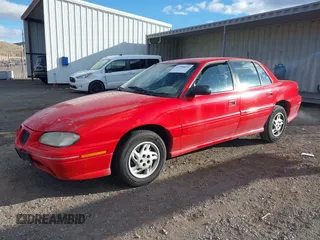 1996 Pontiac Grand Am SE with VIN 1G2NE52T7TC851196, listed as a IAAI auction lot 41700021 with 250,393 mi miles. Bid and sale history available at carsss.com. Image 2.