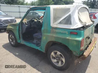 1994 Geo Tracker z VIN 2CNBE18U4R6933505, wystawiony jako Copart lot #68421924 z przebiegiem 203 558 mil mil oraz Szkody całkowita. Historia ofert i sprzedaży dostępna na DreamBid. Obrazek 2.