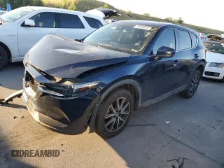 2018 Mazda CX-5 Grand Touring z VIN JM3KFBDM5J0327194, wystawiony jako Copart lot #70260874 z przebiegiem Nie podano mil oraz Szkoda całkowita • Salvage title. Historia ofert i sprzedaży dostępna na DreamBid. Obrazek 1.
