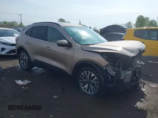 2020 Ford Escape Titanium z VIN 1FMCU9J92LUB48243, wystawiony jako IAAI lot #42143038 z przebiegiem 63 172 mil mil oraz . Historia ofert i sprzedaży dostępna na DreamBid. Obrazek 1.