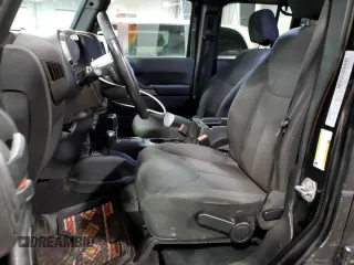2018 Jeep Wrangler JK Unlimited Sport S with VIN 1C4BJWDGXJL830873, listed as a Copart auction lot 74534084 with 59,805 mi miles and Salvage Title. Bid and sale history available at carsss.com. Image 7.