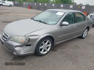 2003 Nissan Maxima SE with VIN JN1DA31DX3T521797, listed as a IAAI auction lot 42737605 with 150,045 mi miles and . Bid and sale history available at DreamBid. Image 2.