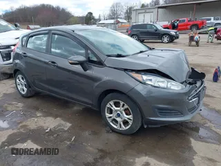2015 Ford Fiesta SE with VIN 3FADP4EJ0FM117739, listed as a IAAI auction lot 41795558 with 111,000 mi miles. Bid and sale history available at carsss.com. Image 1.