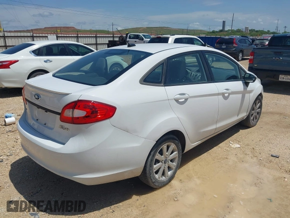 2012 Ford Fiesta SE with VIN 3FADP4BJ8CM161701, listed as a IAAI auction lot 42140579 with 59,496 mi miles. Bid and sale history available at carsss.com. Image 4.