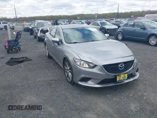 2014 Mazda 6 i Touring with VIN JM1GJ1V64E1147549, listed as a IAAI auction lot 42041025 with 124,400 mi miles and . Bid and sale history available at DreamBid. Image 1.