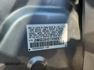 2007 Honda Fit with VIN JHMGD38407S066833, listed as a Copart auction lot 61713125 with 62,917 mi miles and Salvage title. Bid and sale history available at DreamBid. Image 12.