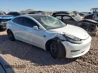 2020 Tesla Model 3 Standard Range Plus with VIN 5YJ3E1EA4LF799597, listed as a Copart auction lot 76401374 with 77,506 mi miles and Salvage Title. Bid and sale history available at DreamBid. Image 4.