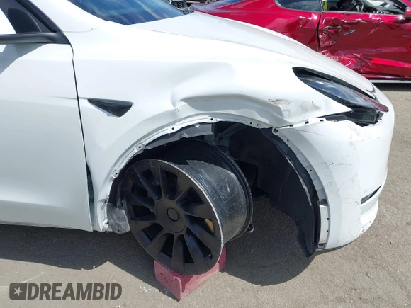 2020 Tesla Model Y Long Range with VIN 5YJYGDEE2LF058515, listed as a IAAI auction lot 41932748 with 62,885 mi miles and . Bid and sale history available at DreamBid. Image 19.