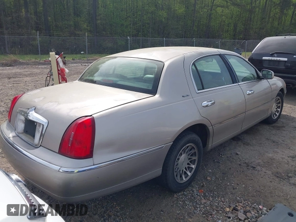 2001 Lincoln Town Car Signature with VIN 1LNHM82W21Y684197, listed as a IAAI auction lot 41944429 with 159,297 mi miles and . Bid and sale history available at DreamBid. Image 4.