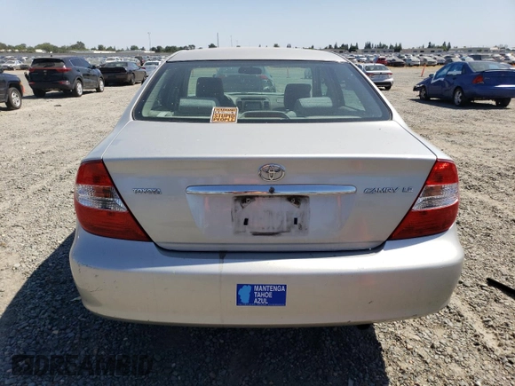 2002 Toyota Camry LE z VIN 4T1BE32KX2U037722, wystawiony jako Copart lot #58482805 z przebiegiem 154 207 mil mil oraz Szkoda całkowita • Salvage title. Historia ofert i sprzedaży dostępna na DreamBid. Obrazek 6.