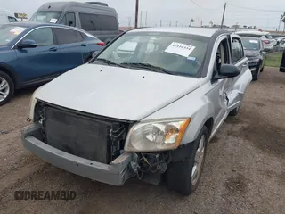 2009 Dodge Caliber SXT with VIN 1B3HB48A59D143888, listed as a IAAI auction lot 42110334 with 182,674 mi miles and . Bid and sale history available at DreamBid. Image 2.