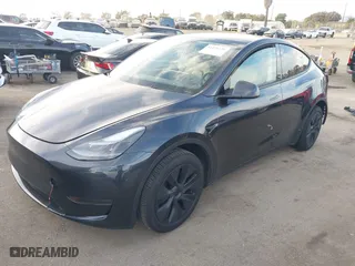 2024 Tesla Model Y with VIN 7SAYGDED7RF153140, listed as a IAAI auction lot 41476728 with NaN miles. Bid and sale history available at carsss.com. Image 21.